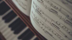 sheet music sitting on piano for music theory classes